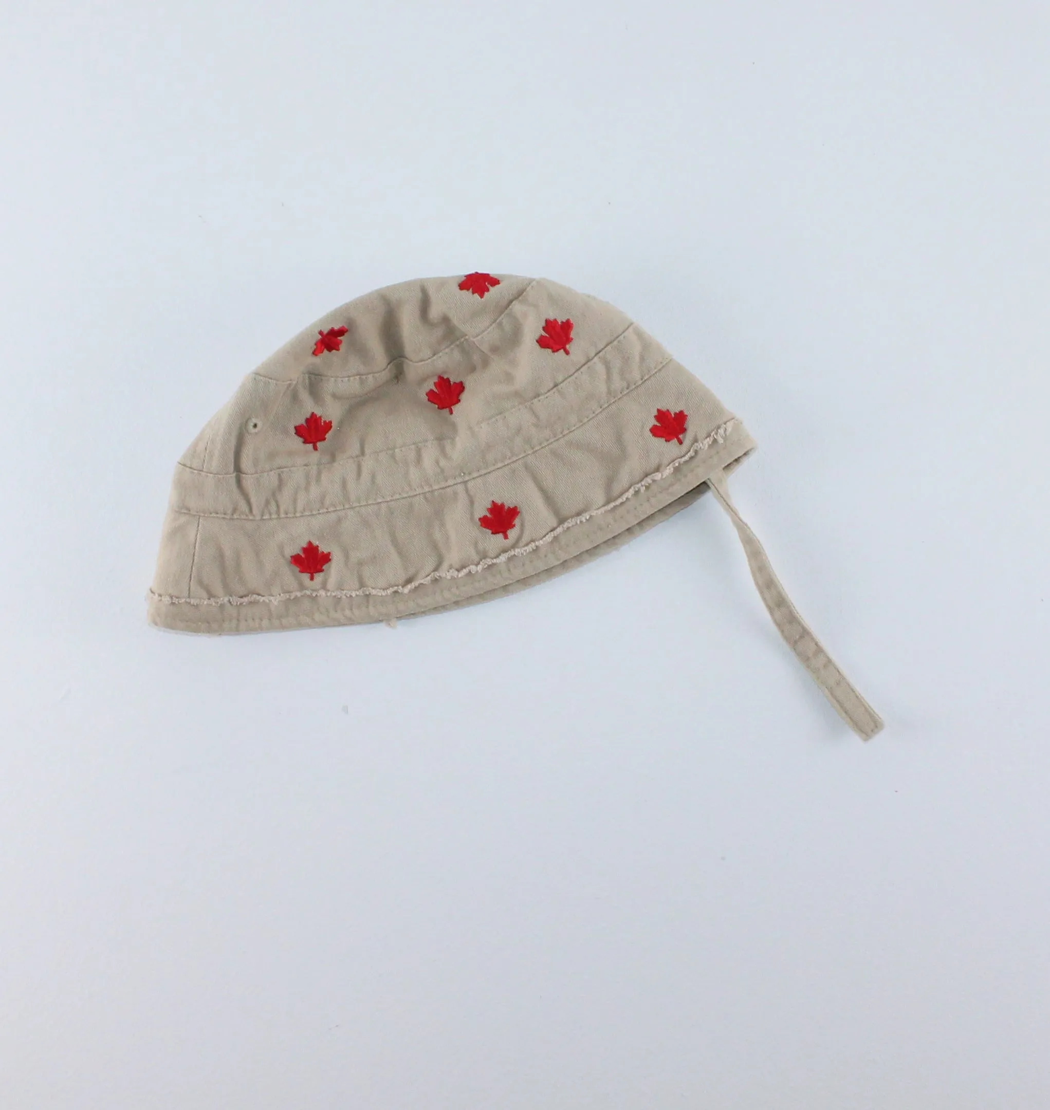 TAN MAPLE LEAF HAT WITH STRAP APPROX 12-18M PRE-LOVED